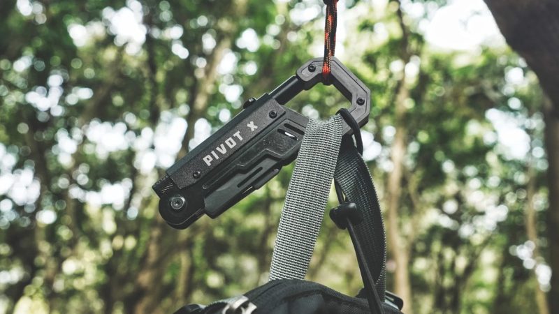 The Pivot X illuminated 8-tool carabiner multi-tool features a 90-degree pivoting pry bar, adjustable wrench, and tungsten steel glass breaker.
