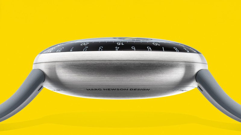 The Ressence x Marc Newson Type 3 MN oil-filled titanium watch with ROCS rotating discs, double-domed sapphire crystal, lug-less design, and limited-edition 80-piece release.