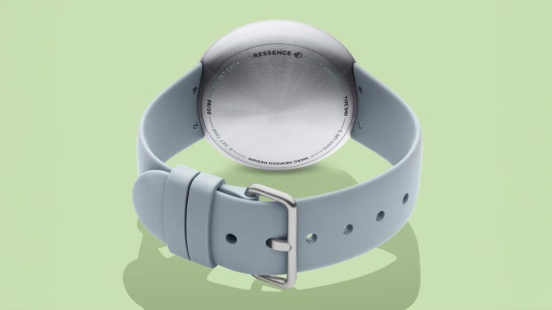 The Ressence x Marc Newson Type 3 MN oil-filled titanium watch with ROCS rotating discs, double-domed sapphire crystal, lug-less design, and limited-edition 80-piece release.