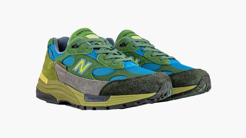 The Salehe Bembury x New Balance 992 Made in USA sneaker features hairy green suede, blue mesh panels, a yellow "N" logo, and a custom lakeside-themed box.