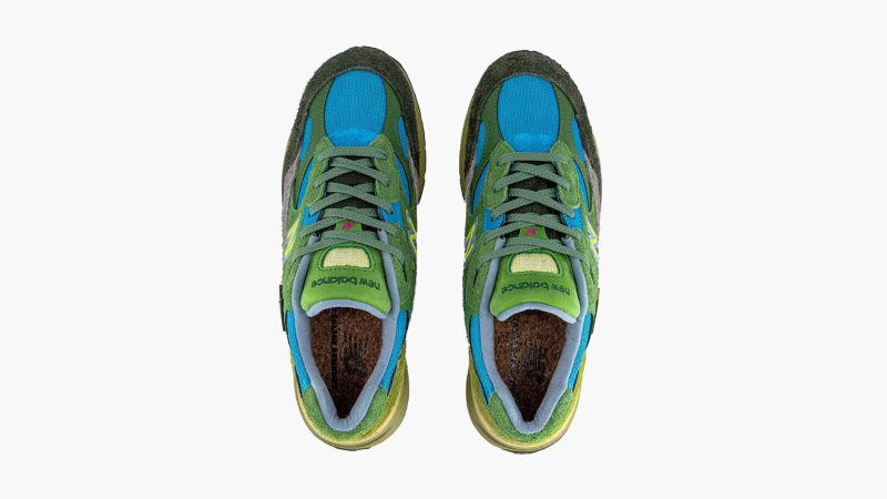 The Salehe Bembury x New Balance 992 Made in USA sneaker features hairy green suede, blue mesh panels, a yellow "N" logo, and a custom lakeside-themed box.