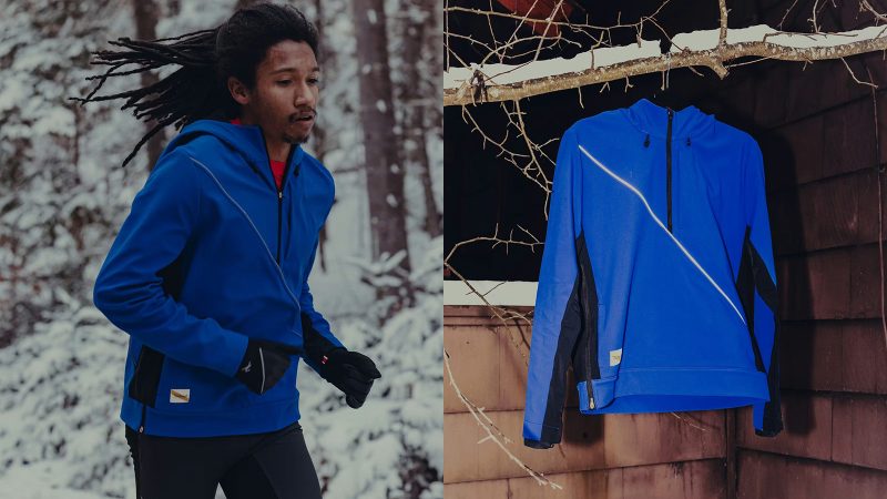 Tracksmith’s NDO Anorak winter running jacket with Merino wool lining, Schoeller softshell exterior, adjustable hood, 360-degree reflectivity, and technical cold-weather design.