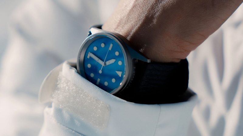 The UNIMATIC Italian Alps Collection watches with Alpine Sky Blue and Glacier White dials, 3D UNILIGHT lume markers, fumo deer leather straps, and 316L steel cases.