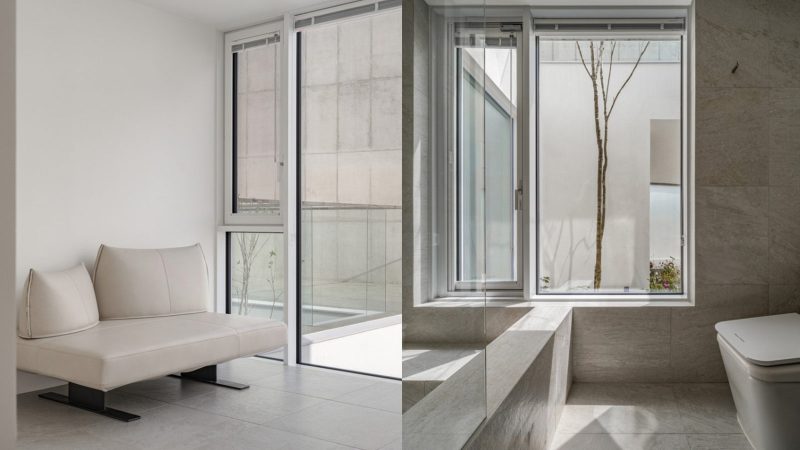 Modern minimalist VEGA House by Archirie featuring white perimeter walls, integrated courtyard gardens, and a sleek second-story terrace with lush plantings.