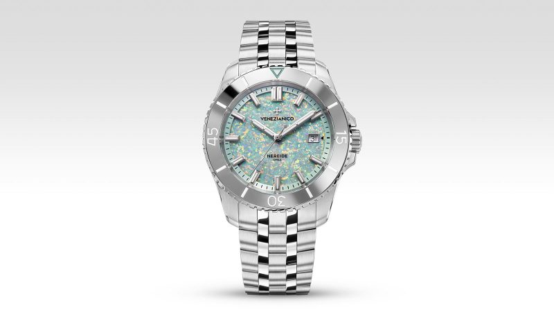 The Venezianico Nereide Opale watch features a shimmering iridescent lab-grown opal dial, gray tungsten bezel, and 42mm stainless steel case.
