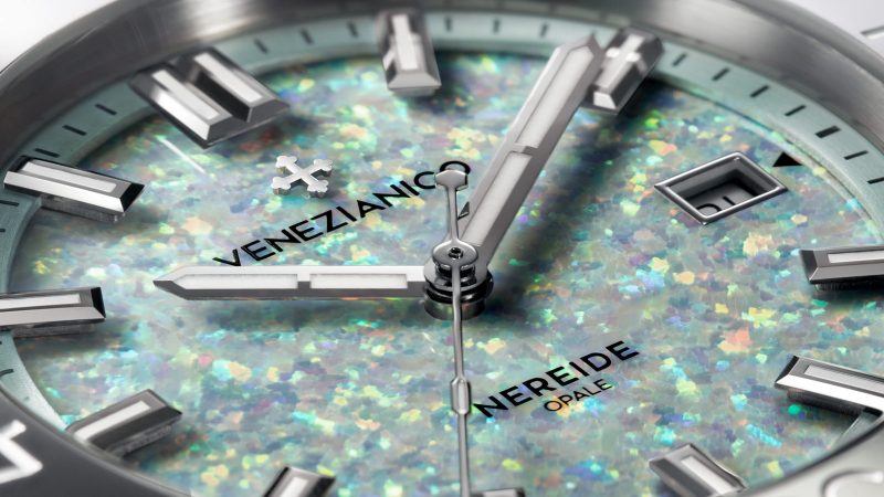 The Venezianico Nereide Opale watch features a shimmering iridescent lab-grown opal dial, gray tungsten bezel, and 42mm stainless steel case.