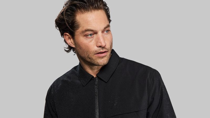 The Vollebak Tech Wool Insulated Jacket features a merino wool shell, advanced insulation, and a high-performance weatherproof design for extreme cold conditions.