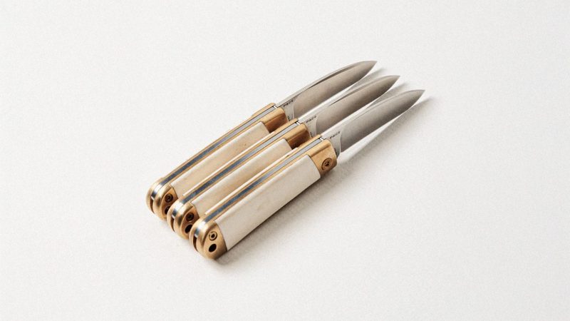 WESN’s Scrimshaw Henry knife Collectionwith brass hardware, ox bone scales, and custom engraving kit for personalized EDC craftsmanship and heritage design.